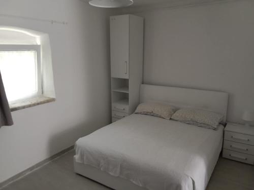 Postel nebo postele na pokoji v ubytování B&B Franciacorta White