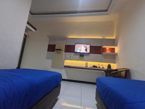 Kuchyň nebo kuchyňský kout v ubytování Hotel Kudus Permata