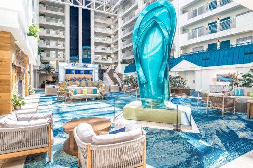 a hotel lobby with chairs and a large blue sculpture at Margaritaville Resort Lake Tahoe in South Lake Tahoe
