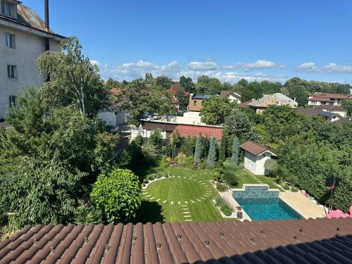 an aerial view of a backyard with a swimming pool and a garden at First Apartments in Focşani