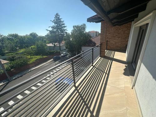 a balcony of a house with a metal fence at First Apartments in Focşani
