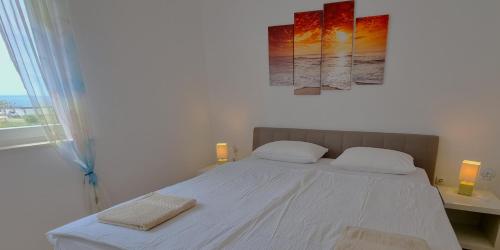 Ένα ή περισσότερα κρεβάτια σε δωμάτιο στο Apartments Le Mare - Pool, Sandstrand, Meerblick, W-Lan, Grill