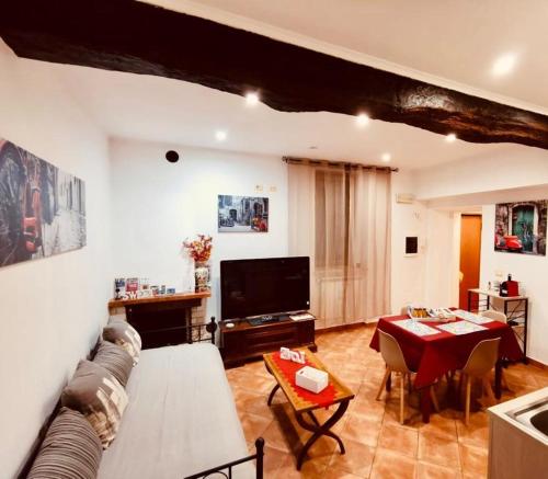 a living room with a couch and a table at La casa del Borgo Anagni in Anagni