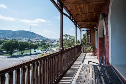 a balcony of a building with a view of a city at Hotel Kopala in Tbilisi City