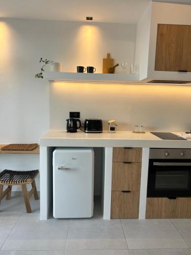 Кухня или мини-кухня в Icon seaside apartments
