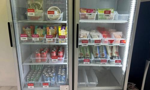 a refrigerator filled with lots of food and drinks at Anyang ILLOWA Hotel in Anyang