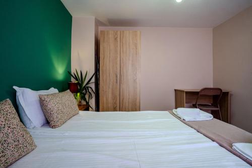 Ένα ή περισσότερα κρεβάτια σε δωμάτιο στο Aleko Apartments City Center