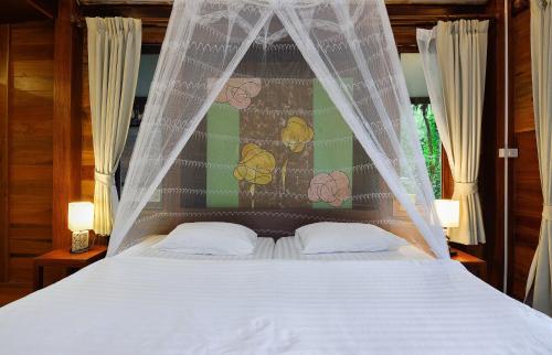 Postel nebo postele na pokoji v ubytování Koh Kood Resort