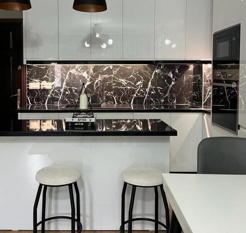 Kuchyň nebo kuchyňský kout v ubytování Belle Apartment