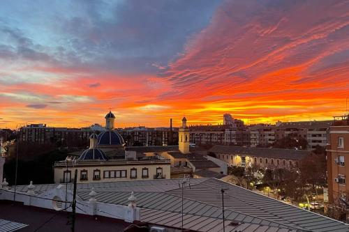a view of a city skyline with a sunset at Elegant Rooftop by F2 Rental Home in Valencia