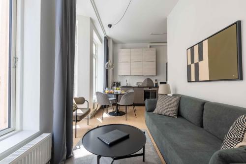 a living room with a couch and a table at Perfect City-Break Apartment in CPH in Copenhagen