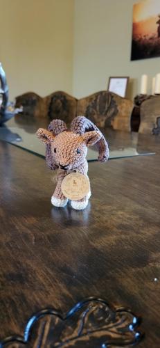 a teddy bear sitting on top of a table at Tekeres-patak Fogadó in Pálosvörösmart
