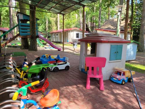 a group of childrens toys on a patio at Letnisko BAJKA in Iława