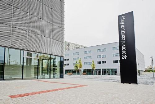a building with a sign in front of it at Smarty Choice Living with FREE PARKING - Vondroušova in Prague