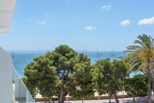 a view of the ocean from the balcony of a building at Hotel Palia Tropico Playa in Palmanova
