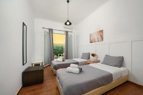 Ένα ή περισσότερα κρεβάτια σε δωμάτιο στο Olive Grove Poolside Apartments