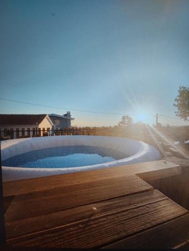 a large swimming pool sitting on the side of a house at Casa do Alto in Oliveira de Frades