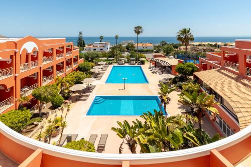 an aerial view of a resort with a swimming pool at Belavista Da Luz - Wellness & Lifestyle Hotel in Luz