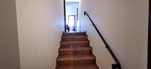 a stairway with a hand rail and a stair case at Le Querce in Spoltore
