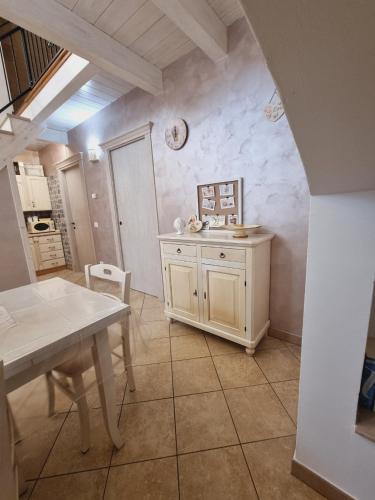 a kitchen with a table and a table and a dining room at Casa vacanze San Martino in Ginosa