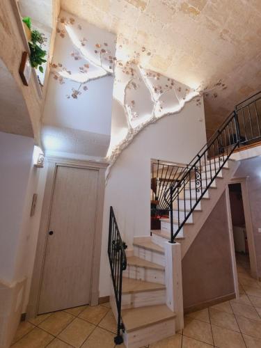 a staircase in a building with a white ceiling at Casa vacanze San Martino in Ginosa