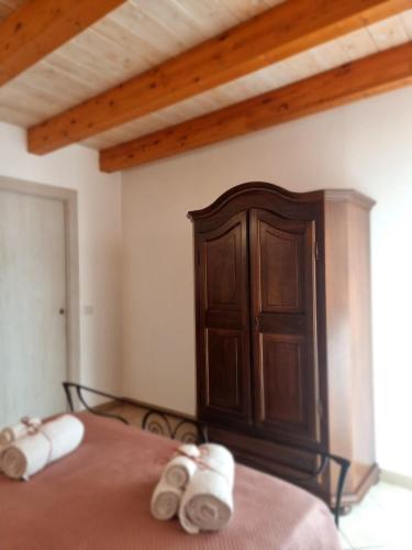 a bed with two slippers on top of it at Casa vacanze San Martino in Ginosa