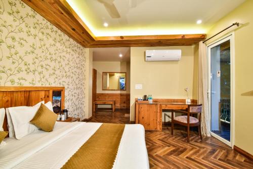 a bedroom with a bed and a desk at D's Casa - A Unique Spanish Boutique House in McLeod Ganj