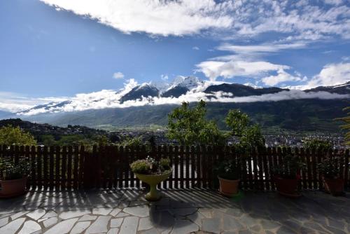 a fence with a view of a mountain at Zona Panoramica - Bluchalet in Aosta