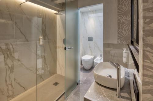 Koupelna v ubytování Poggio Hotel
