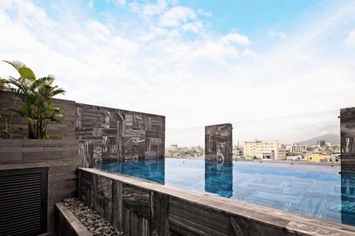 a view from the balcony of a building with a swimming pool at Hoàng Thịnh Hotel & Apartment Danang in Danang