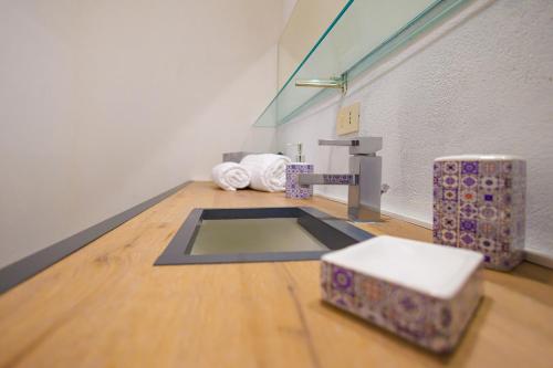 a bathroom with a sink in a room at Allegra Experience in Taormina