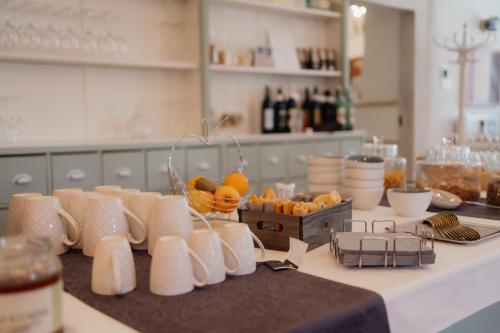a kitchen counter with a bunch of fruit on it at De Merin Boutique Hotel Straden in Straden