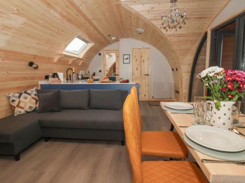 a living room with a couch and a table at Lapwing in Carnforth