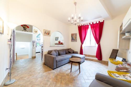 a living room with a couch and a table at Radici Etrusche Sutri in Sutri