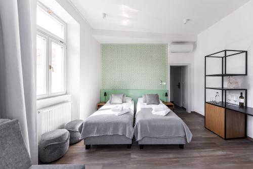 Postel nebo postele na pokoji v ubytování Hotel Radost