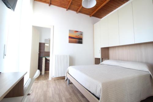 Postel nebo postele na pokoji v ubytování Acquacorrente Rooms - a due passi dal mare