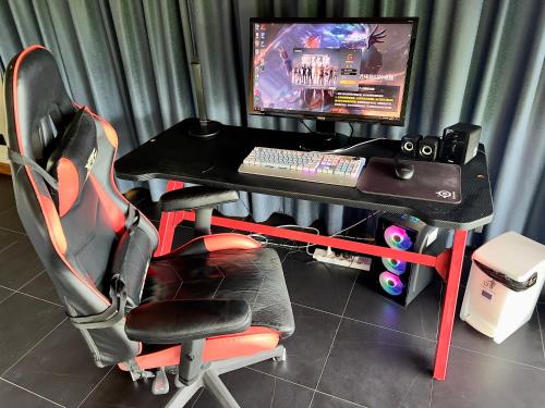 a computer desk with a keyboard and a monitor at 苏梅岛观景台海景別墅Golden Coconut Villa 5 超级海景 私密泳池 接送服务 in Koh Samui 