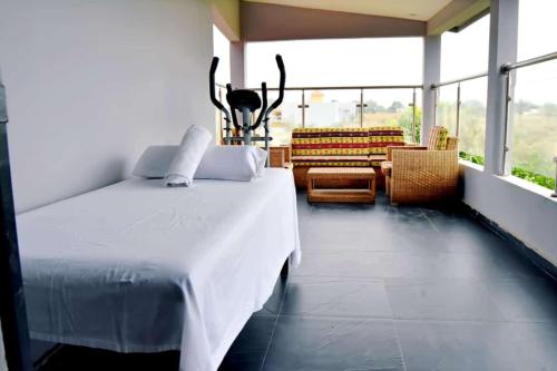 a bedroom with a bed with antlers on the wall at villla tourama in Saly Niakh-Niakhal