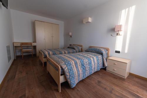 Postel nebo postele na pokoji v ubytování Hotel Edera