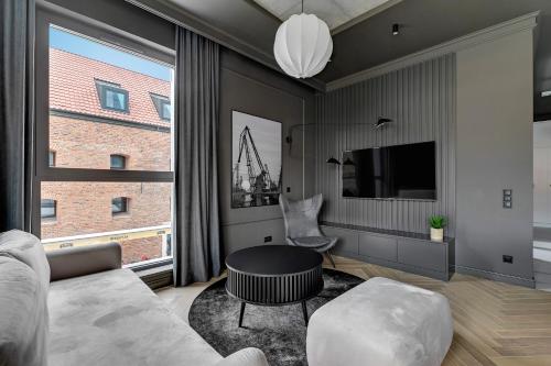 Televízia a/alebo spoločenská miestnosť v ubytovaní Comfort Apartments Granaria