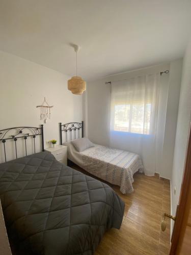 Posteľ alebo postele v izbe v ubytovaní Acogedor apartamento en el paraiso