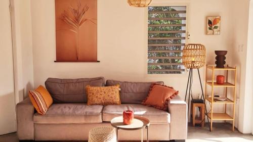 a living room with a couch and a table at 12 Casa Hermanito in Kralendijk