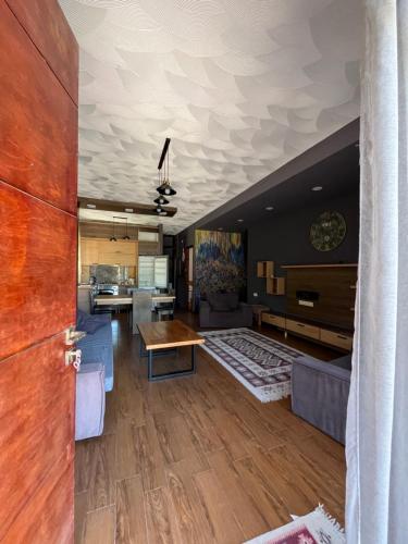 a living room with a couch and a table at HOTEL Dadu in Batumi