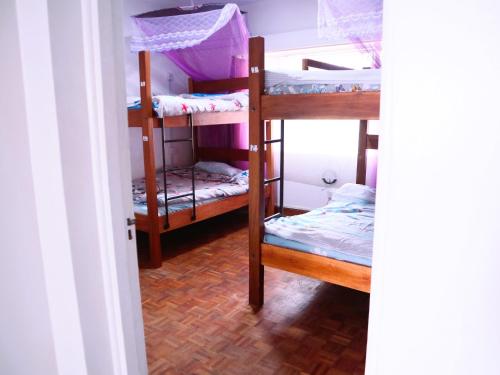 Una cama o camas en una habitación de Jabulani Nairobi Backpackers Hostel