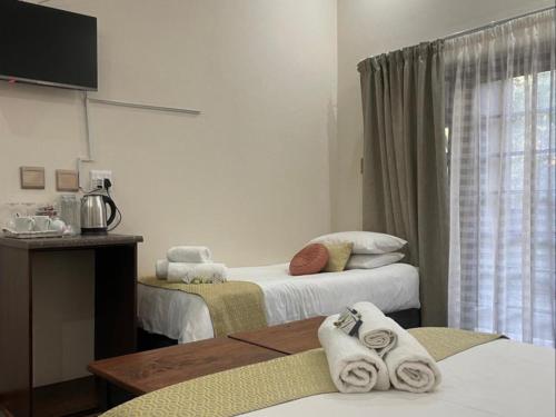Postel nebo postele na pokoji v ubytování 12 On York Guesthouse