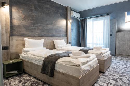 Una cama o camas en una habitación de RCR Einstein studios 2