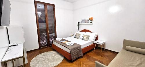 Postel nebo postele na pokoji v ubytování VATICAN ERA Guest House