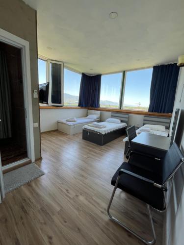 a large living room with a couch and a table at HOTEL Dadu in Batumi
