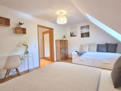 a bedroom with a bed and a desk in it at 2 room apt at It-district Neustadt & free parking in Dresden