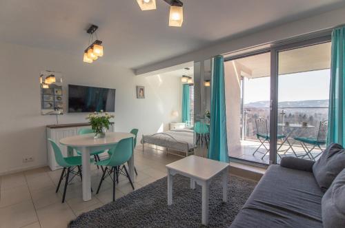 a living room with a couch and a table at Apartview Bukowa III by Rent like home in Wisła